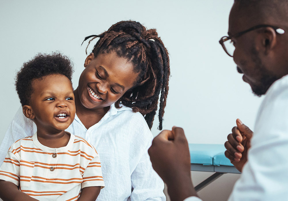 mother and son with a doctor
